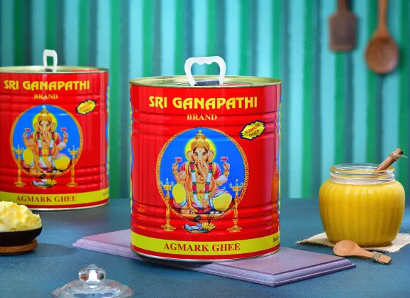 Sri Ganapathi Ghee's tin of bulk pack includes purity and richness, prepared from fresh cow's milk.