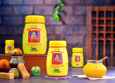 Several jars of ghee filled and labeled as Sri Ganapathi ghee are the best for sweet manufacturers.