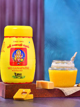 Two jars are filled with ghee and are made by a pure ghee manufacturer and supplier in Coimbatore.