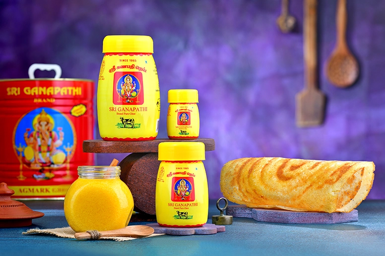 Three different sizes of ganapathi ghee bottles for the use of hotel chefs to make ghee dosas.