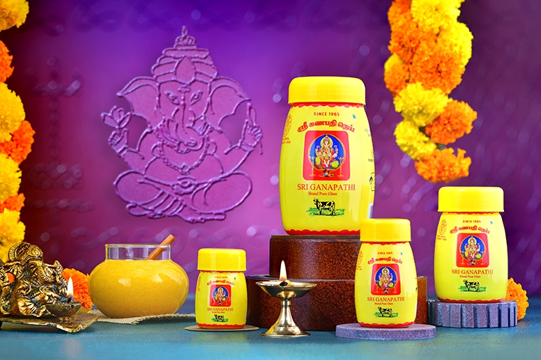 Various bottles of organic cow ghee to lighten lamps in the home and temple from a ghee supplier.